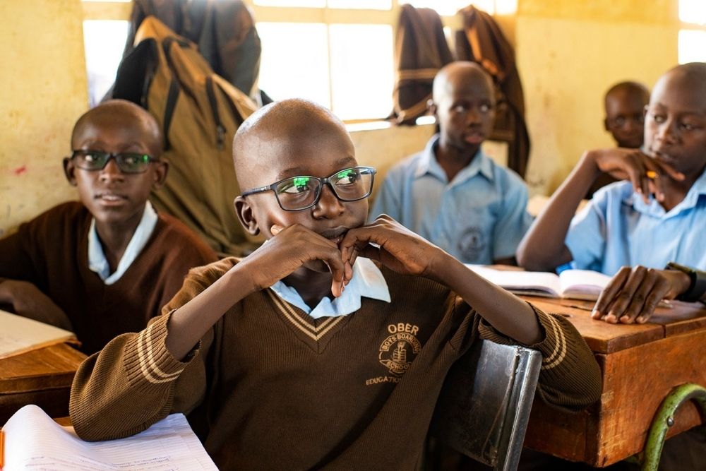 boy in class wearing eyeglasses