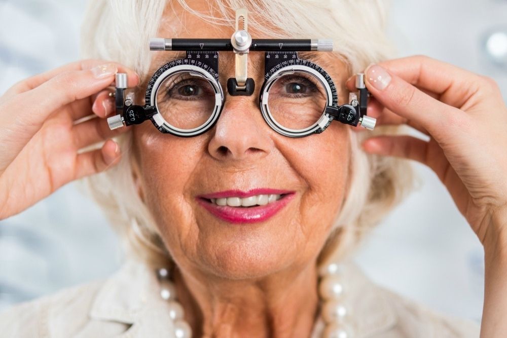 middle aged woman wearing an eye exam equipment